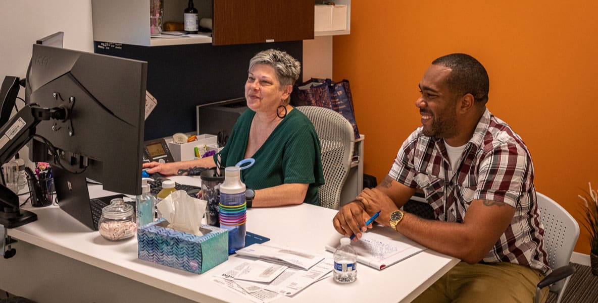 two arrivia employees work together on a project