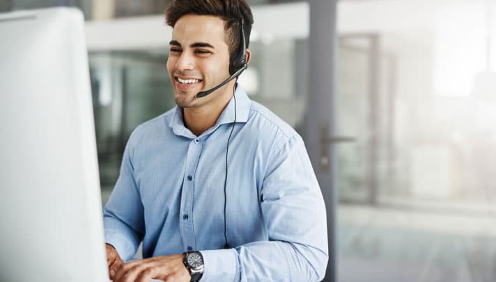 an arrivia customer service representative smiles while helping a client