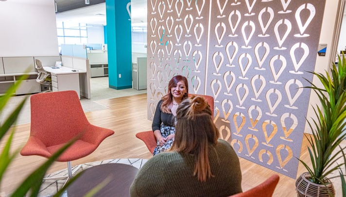 a newly hired employee meets a supervisor in the lobby of our arrivia office